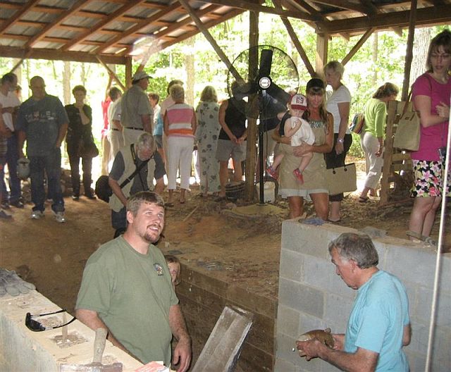 Matt Luck answers questions at kiln opening